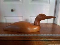 Left side view showing full length next to ruler