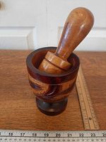 Mortar and pestle angled view with ruler for scale
