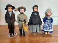 Group shot of four Madame Alexander Gone With The Wind dolls on stands