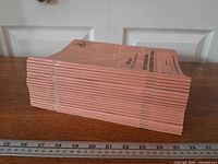 Side view of stacked notebooks showing quantity and spines