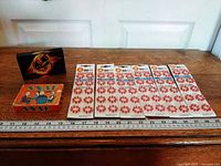 Group view showing acrylic block, Snap Snap tin, five cards of appliqués with ruler for scale