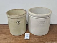 Front view of both crocks showing logos and size comparison