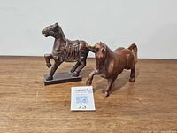 Both horse figurines side by side for scale and overview