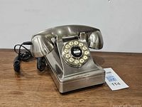 Front view of Crosley brushed metal telephone