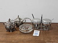 Group shot of all items: condiment set, footed cream and sugar, glass serving dish