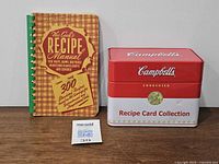 Cookbook and closed Campbell’s tin front view