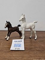 Both Royal Doulton foal figurines side by side