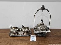 Full view of butter dish, spreader, sugar, creamer and tray