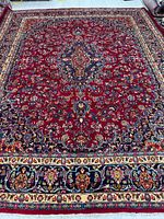 Full view of entire rug showing design and borders