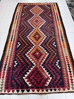 Full view of entire kilim showing pattern and condition