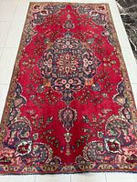 Full view of Persian Tabriz rug showing overall design and dimensions