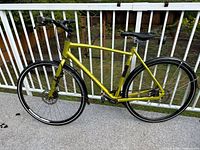 Full side view of metallic green Brodie Dos 2.2 commuter bike with fenders and disc brakes