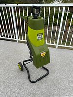 Front angled view of Sun Joe CJ601E chipper on wheels