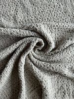 Close-up swirl showing beige waffle linen texture
