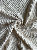Close-up of waffle weave texture in white linen fabric