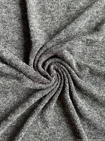 Close-up of fabric twisted to show drape and knit texture