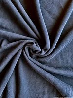 Close-up of fabric twisted to show texture and drape