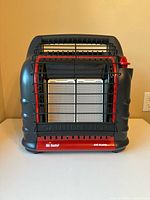 Front view of heater showing ceramic panels, guard, and controls