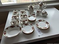 Full view of the 36-piece Old Country Roses china set laid out