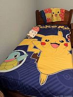 Comforter and pillowcase displayed on twin bed
