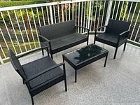 Full patio set showing loveseat, two chairs, table