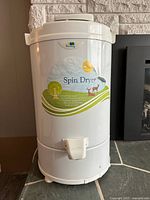 Front view of white The Laundry Alternative spin dryer