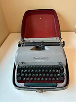 Front view of Remington Quiet-Riter typewriter seated in open hard case