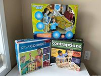 Three boxed building sets: KEVA Connect, KEVA Contraptions 200 planks, Discovery Kids Construction Fort 72 pieces