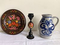 Group shot showing plate, candlestick, pitcher