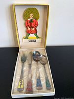 Boxed BSF children’s cutlery set showing four pieces and Struwwelpeter figure insert