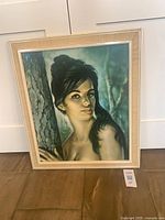 Full view of framed portrait showing frame, mat and image