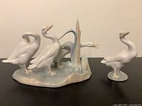 Front view of both Lladró goose figurines