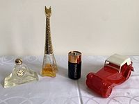 group shot of all four Avon collectible bottles