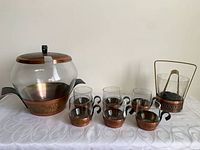Entire punch set displayed: lidded server, six glasses, ice bucket, tongs
