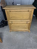 Front view of closed oak veneer shoe cabinet