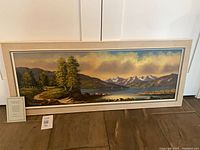 Frontal view of framed Hansen oil painting with certificate visible