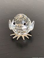 Front view of Swarovski crystal chick showing facial details, wings, feet