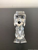 Front view of Swarovski crystal dog figurine standing on hind legs