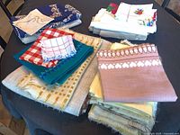 Assorted folded table linens on table