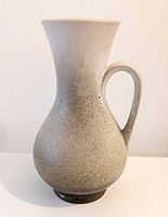 Front view of speckled handled vase