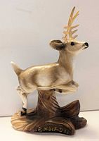 Front view of chalkware deer on base showing Canada mark