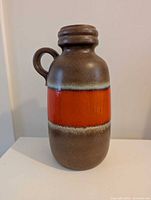 Front view of brown and orange West German ceramic vase