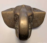 Front view of brass elephant head hanger