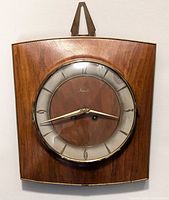 Front view of Mauthe wall clock hung on wall