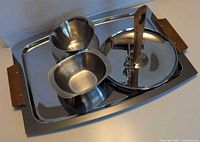 All items grouped on stainless tray showing overall lot