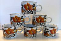Front view of six Midwinter Stonehenge Autumn coffee cups stacked
