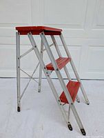 Full view of folded ladder showing overall design and condition