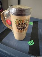 Full view of sealed 2012 Tim Hortons travel mug