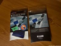Front view showing two packages labeled Wrist Sport Sleeve / Manchon de Sport pour Poignet, one containing sleeve and one empty