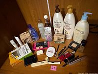 Front view of entire lot on shelf including lotions, soaps, thermometer, cosmetics